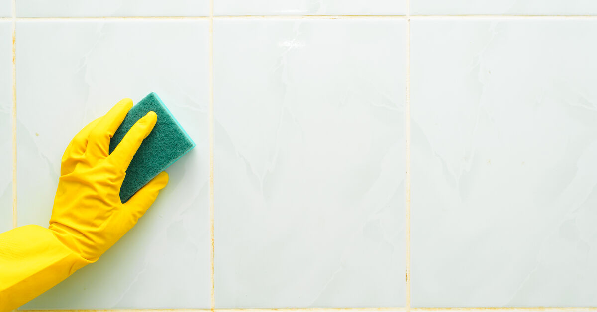 Yellowed grout lines between shower tiles