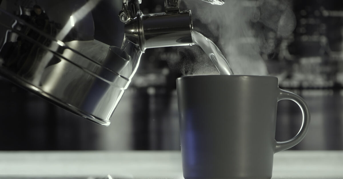 Kettle with hot water and steam