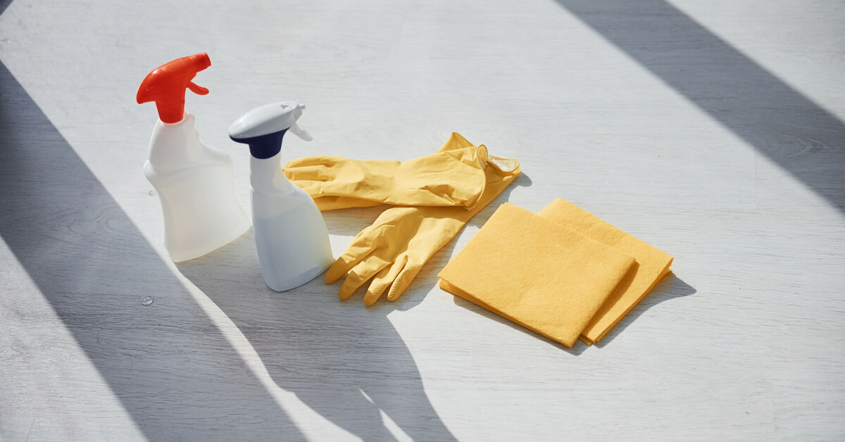 Cleaning supplies ready by apartment door