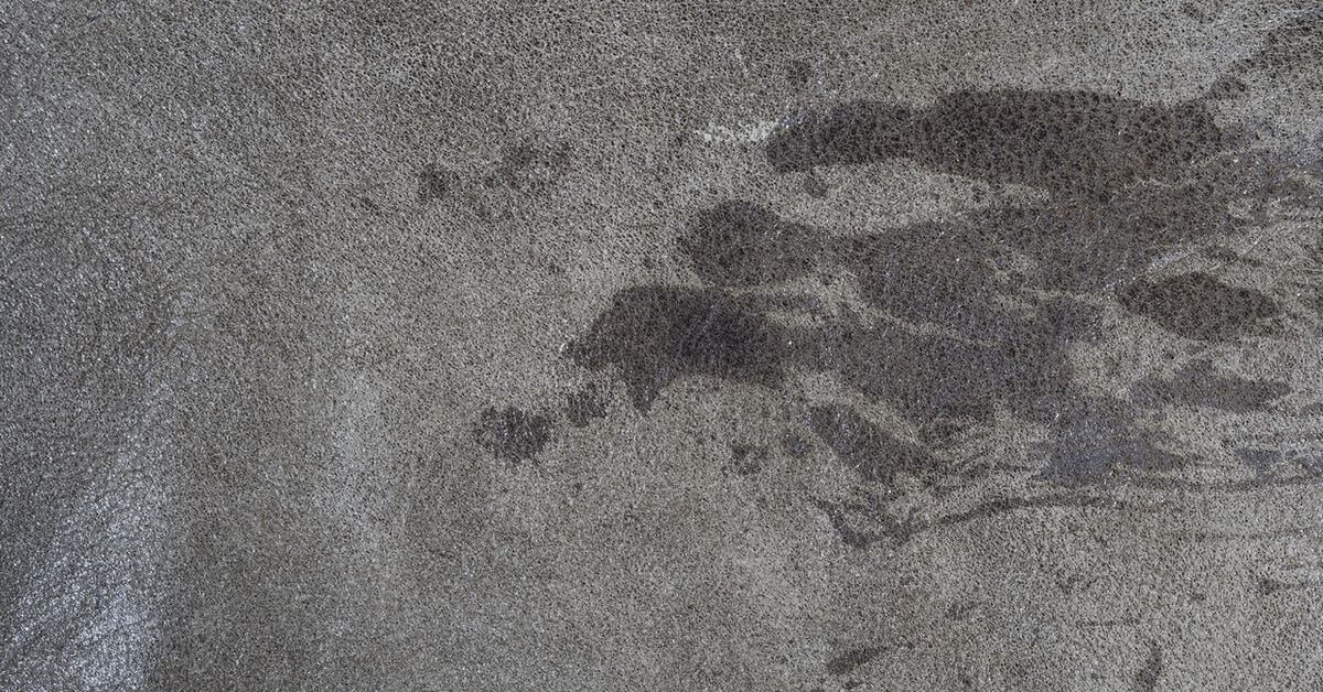 Liquid stain spreading across carpet